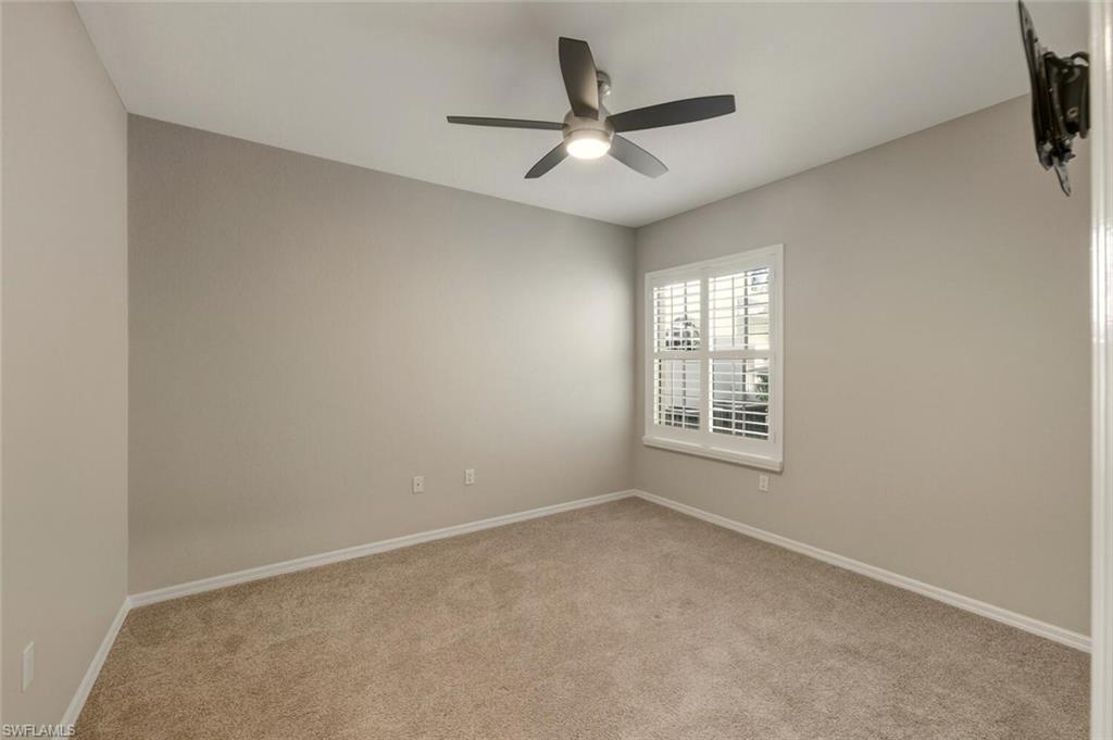 7005 Pinnacle Lane, Unit 1501 Naples, FL 34110 - Photo 24 of 46 a view of an empty room with a window