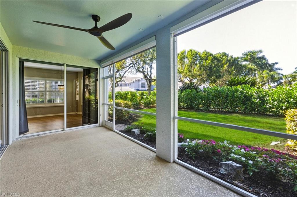 7005 Pinnacle Lane, Unit 1501 Naples, FL 34110 - Photo 26 of 46 a front view of a house with garden