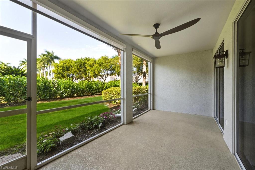 7005 Pinnacle Lane, Unit 1501 Naples, FL 34110 - Photo 27 of 46 a view of a porch and garden