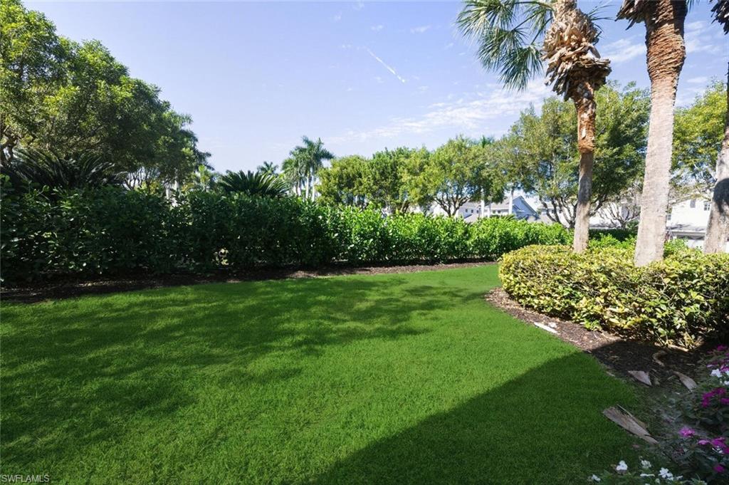 7005 Pinnacle Lane, Unit 1501 Naples, FL 34110 - Photo 28 of 46 a view of a garden