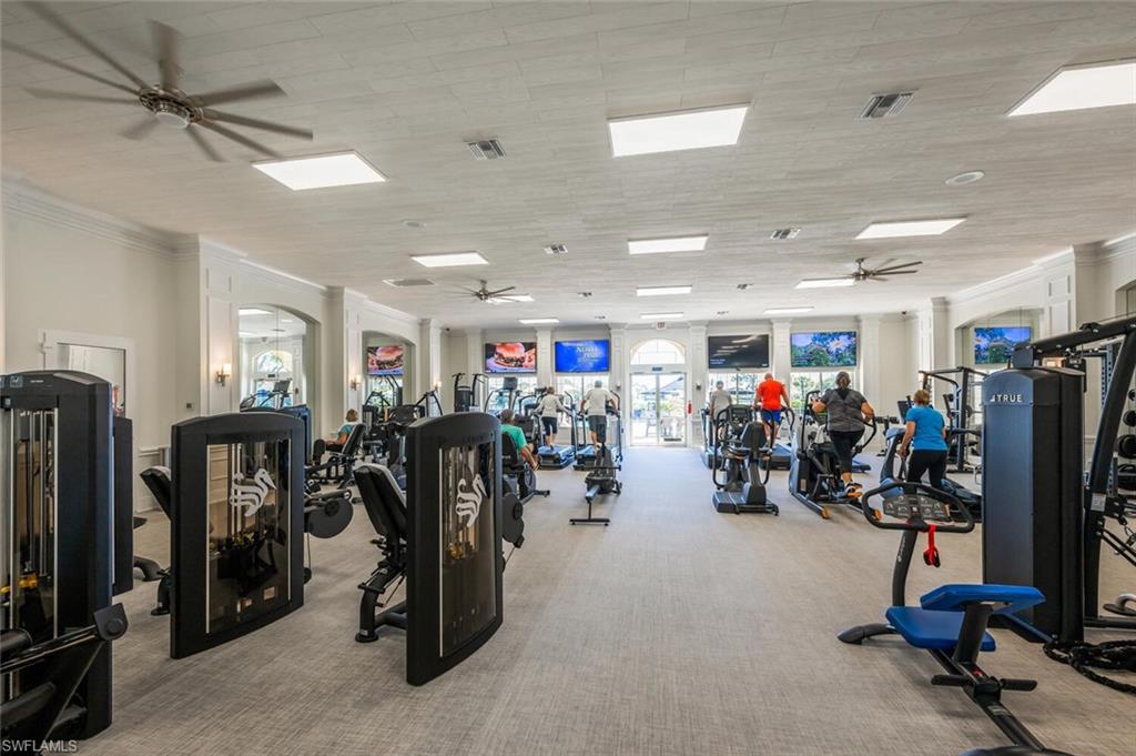 7005 Pinnacle Lane, Unit 1501 Naples, FL 34110 - Photo 37 of 46 a view of a room with gym equipment