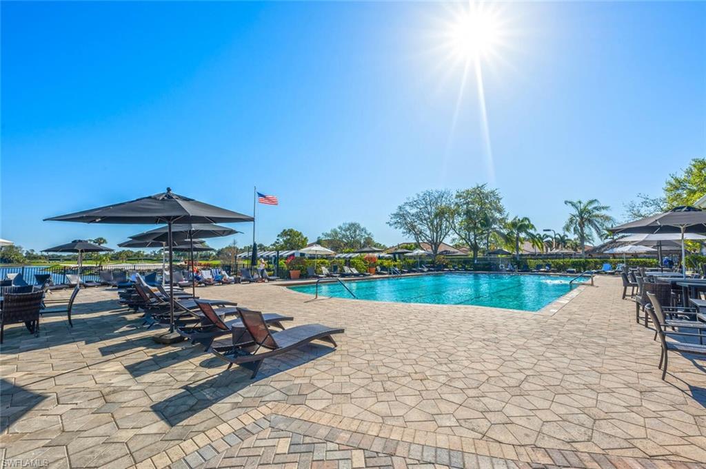 7005 Pinnacle Lane, Unit 1501 Naples, FL 34110 - Photo 42 of 46 a view of a lake with sitting area