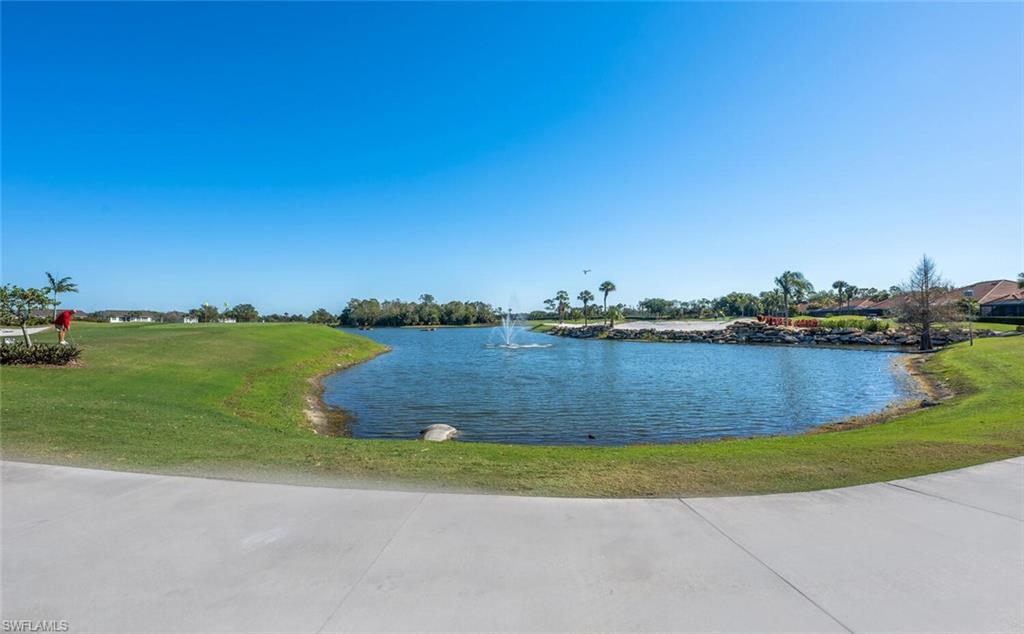 7005 Pinnacle Lane, Unit 1501 Naples, FL 34110 - Photo 46 of 46 a view of a lake with houses