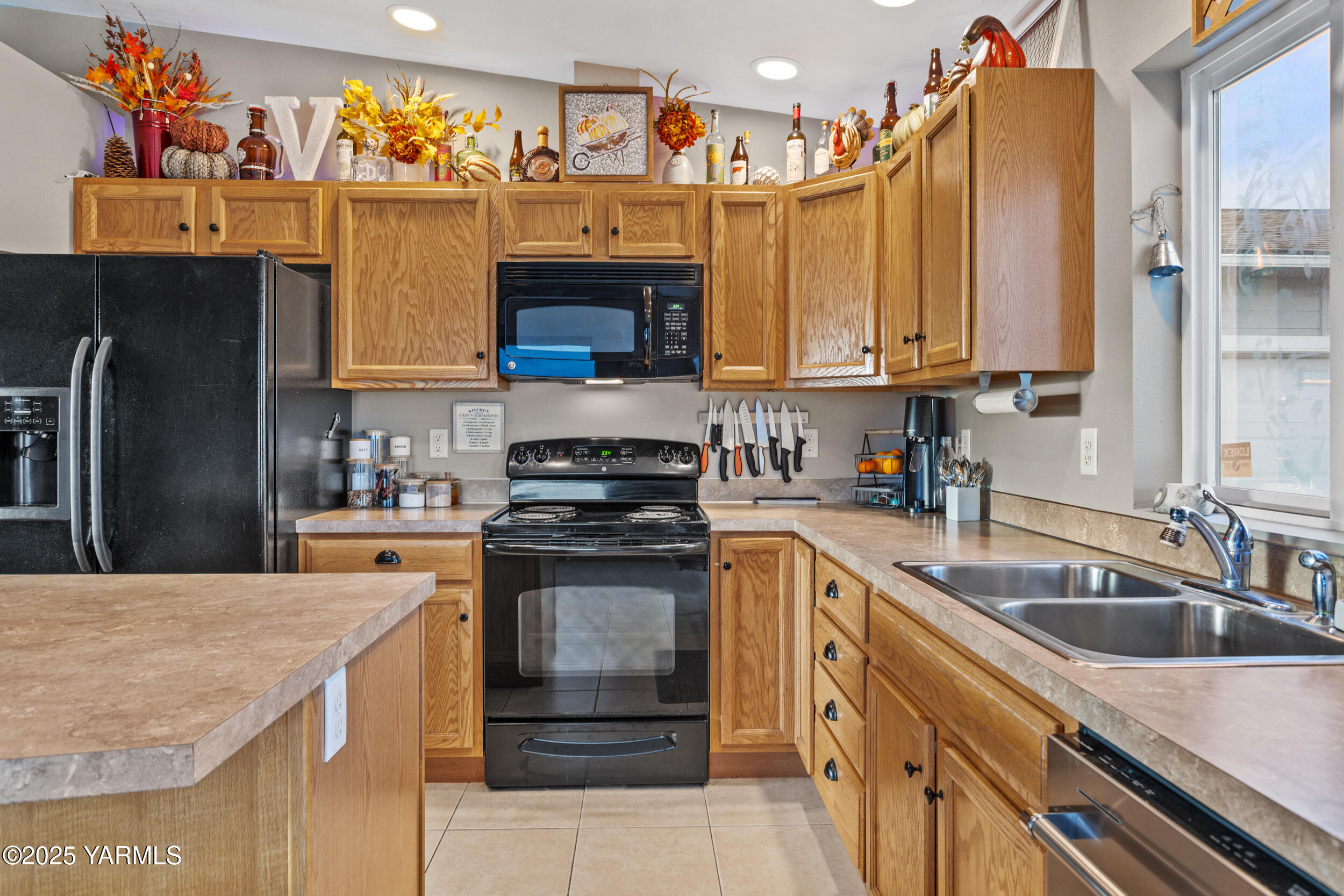 150 Solar Lane Yakima, WA 98901 - Photo 11 of 27 a kitchen with stainless steel appliances granite countertop a sink stove and refrigerator