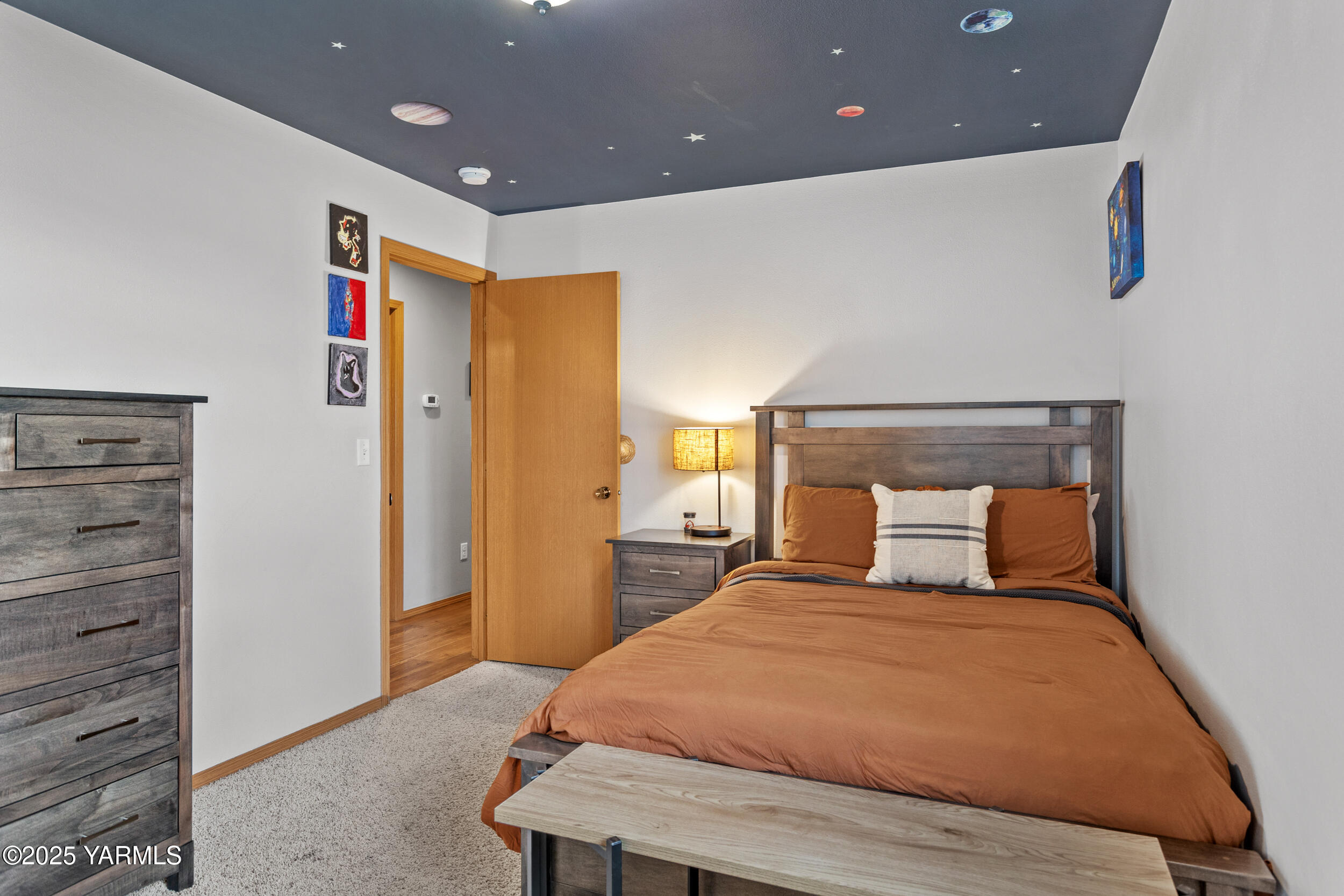 150 Solar Lane Yakima, WA 98901 - Photo 12 of 27 a bedroom with a bed and a dresser