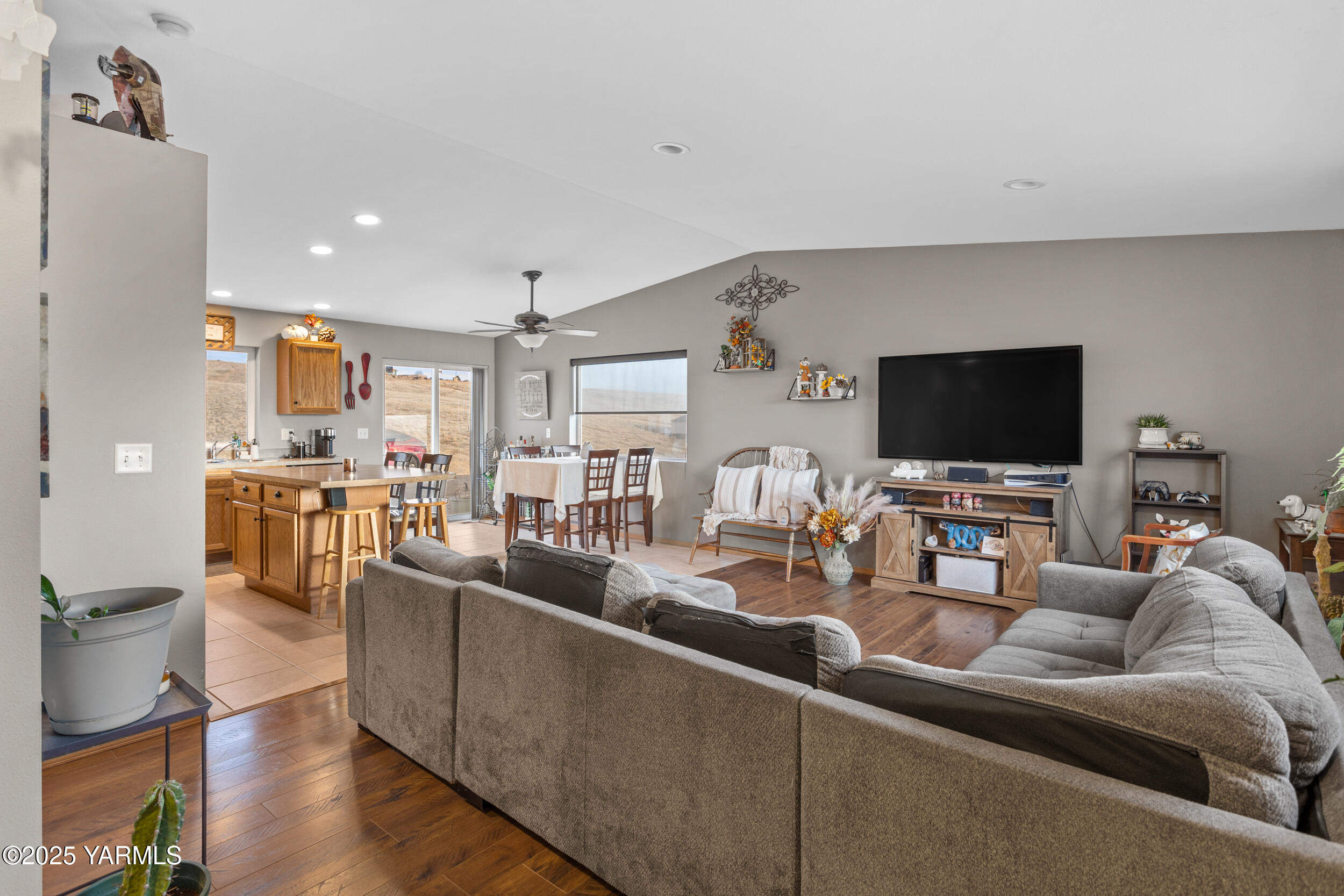 150 Solar Lane Yakima, WA 98901 - Photo 2 of 27 a living room with furniture and a flat screen tv
