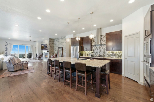 987 East Deer Arch Lane Draper, UT 84020 - Photo 12 of 46 Open great room with hardwood floors, huge island and stunning view!