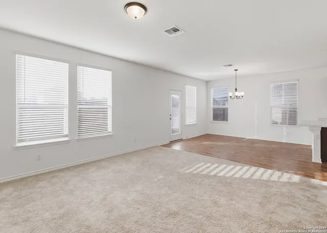 a view of empty room with windows