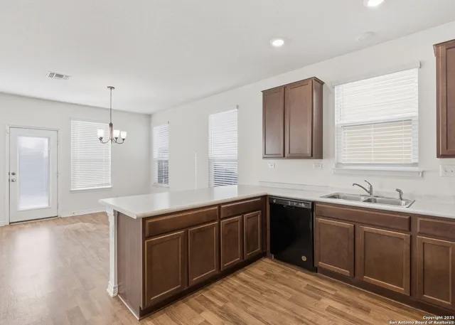 a kitchen with a sink and cabinets
