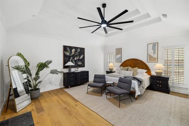 a bedroom with a bed and a fireplace