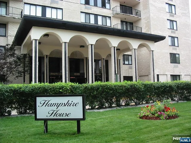 a view of a sign board with a yard