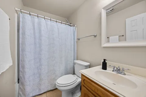 a bedroom with a bed and a television