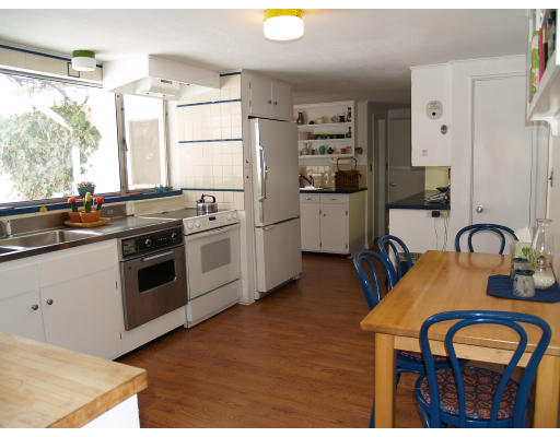 69 Silver Hill Road Lincoln, MA 01773 - Photo 4 of 9 a kitchen with stainless steel appliances granite countertop a stove a sink dishwasher and white cabinets with wooden floor