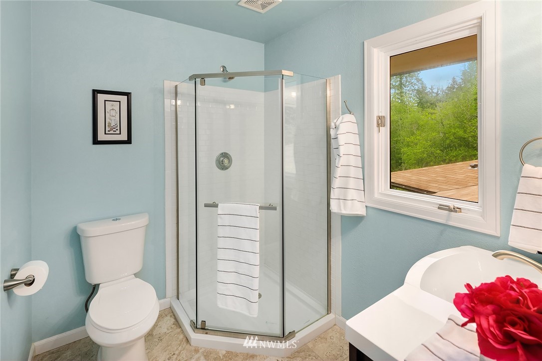 27819 Southeast Issaquah-Fall City Road Fall City, WA 98024 - Photo 19 of 39 a white toilet sitting next to a bathroom sink