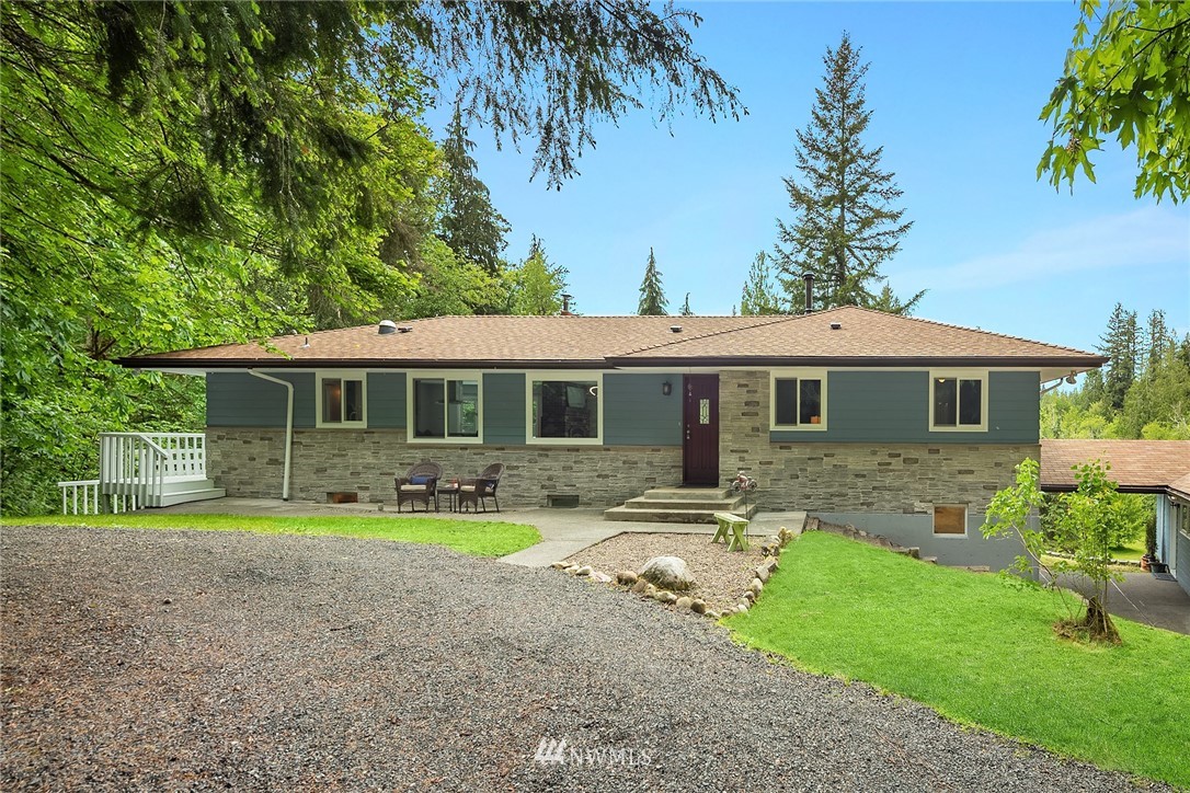 27819 Southeast Issaquah-Fall City Road Fall City, WA 98024 - Photo 3 of 39 a front view of a house with yard and green space