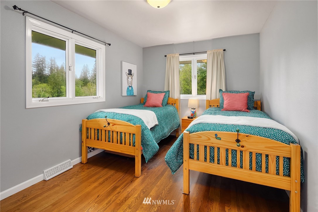 27819 Southeast Issaquah-Fall City Road Fall City, WA 98024 - Photo 21 of 39 a bedroom with two beds and a window