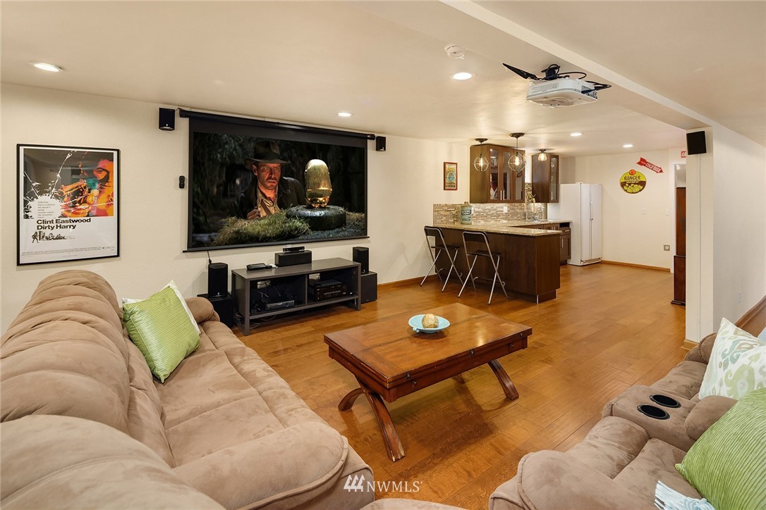 27819 Southeast Issaquah-Fall City Road Fall City, WA 98024 - Photo 24 of 39 a living room with furniture and a flat screen tv