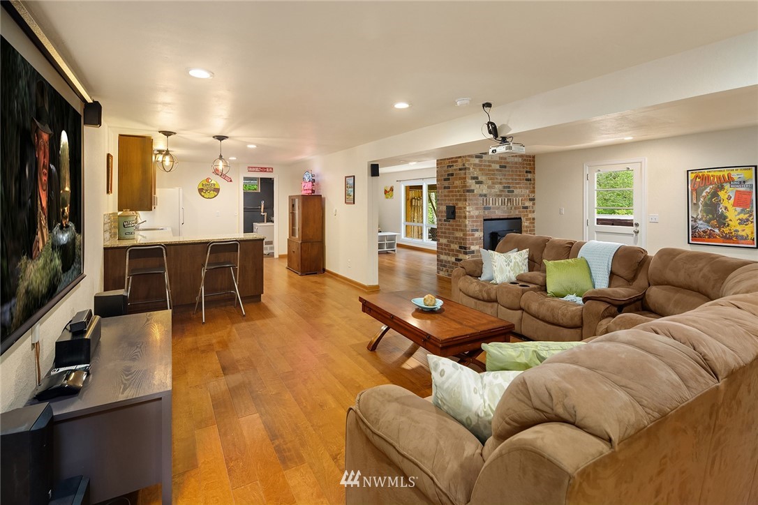 27819 Southeast Issaquah-Fall City Road Fall City, WA 98024 - Photo 25 of 39 a living room with furniture kitchen view and a large window