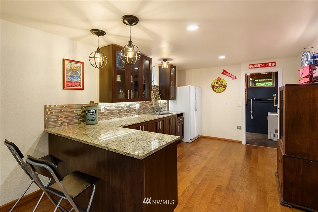 27819 Southeast Issaquah-Fall City Road Fall City, WA 98024 - Photo 26 of 39 a kitchen with a sink a refrigerator and a stove