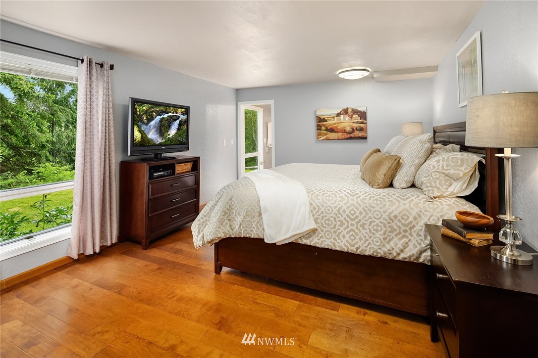27819 Southeast Issaquah-Fall City Road Fall City, WA 98024 - Photo 27 of 39 a bedroom with a bed dresser and window