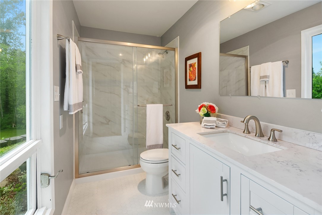 27819 Southeast Issaquah-Fall City Road Fall City, WA 98024 - Photo 28 of 39 a bathroom with a sink toilet vanity and shower