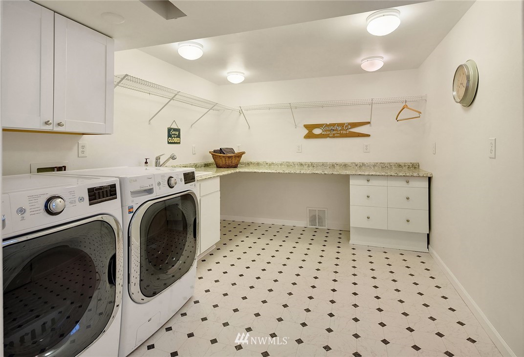 27819 Southeast Issaquah-Fall City Road Fall City, WA 98024 - Photo 31 of 39 a kitchen with a sink a washer and dryer