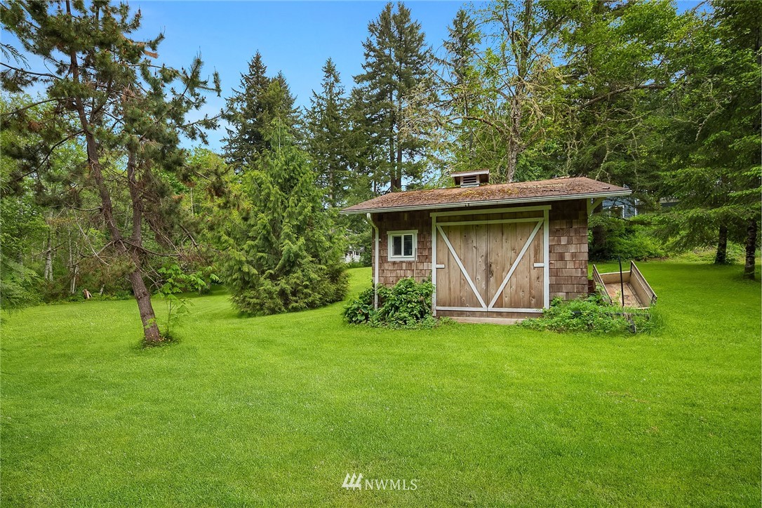 27819 Southeast Issaquah-Fall City Road Fall City, WA 98024 - Photo 37 of 39 a view of a wooden house with a yard