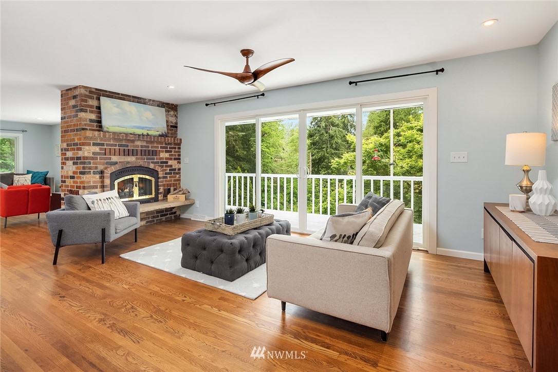 27819 Southeast Issaquah-Fall City Road Fall City, WA 98024 - Photo 8 of 39 a living room with furniture and a fireplace