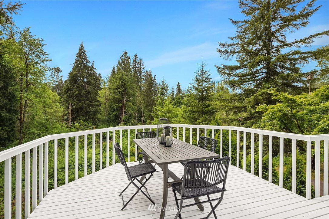 27819 Southeast Issaquah-Fall City Road Fall City, WA 98024 - Photo 9 of 39 a view of balcony with wooden floor and outdoor seating