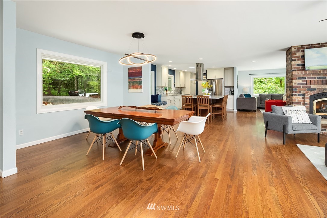 27819 Southeast Issaquah-Fall City Road Fall City, WA 98024 - Photo 10 of 39 a dining room with furniture and wooden floor