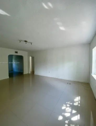 a view of a livingroom and a fireplace