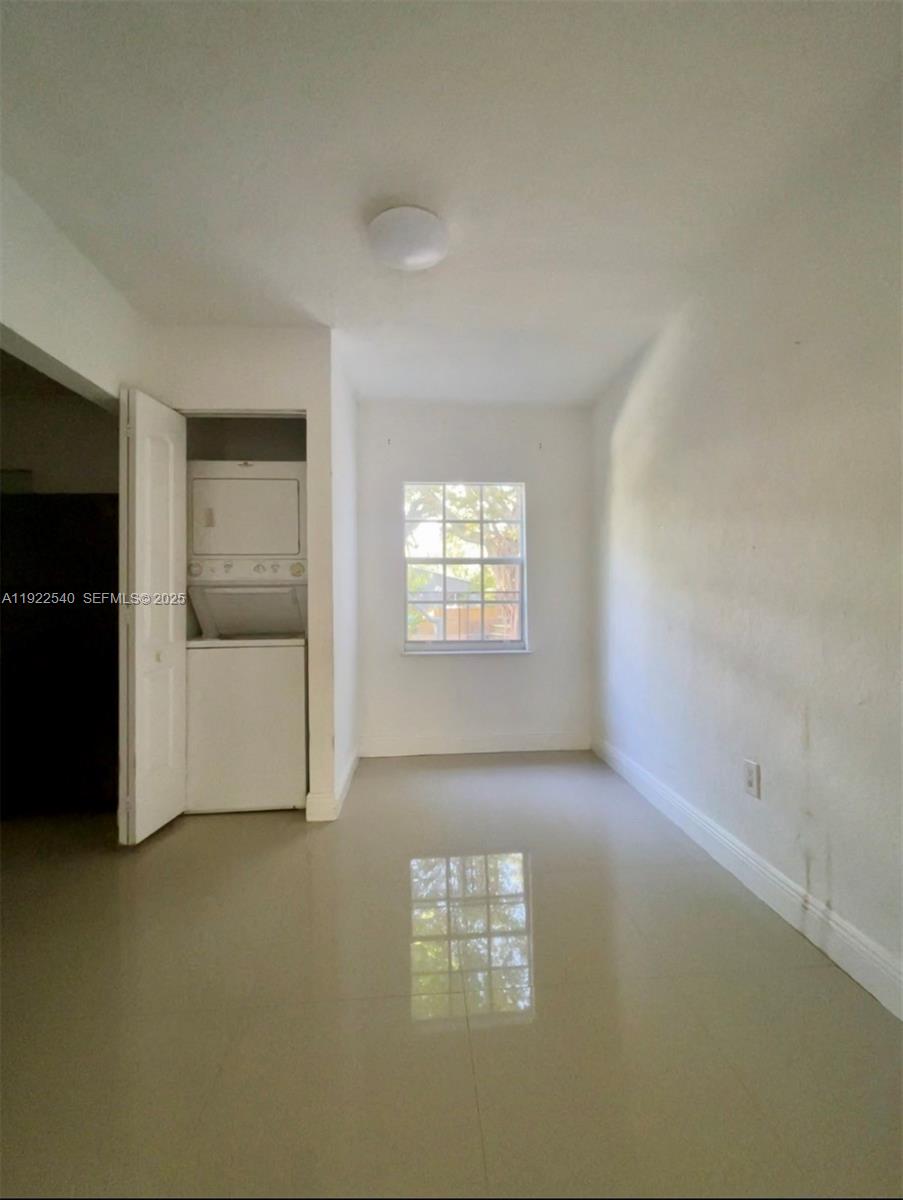 531 Northeast 68th Street, Unit 1 Miami, FL 33138 - Photo 5 of 11 an empty room with windows