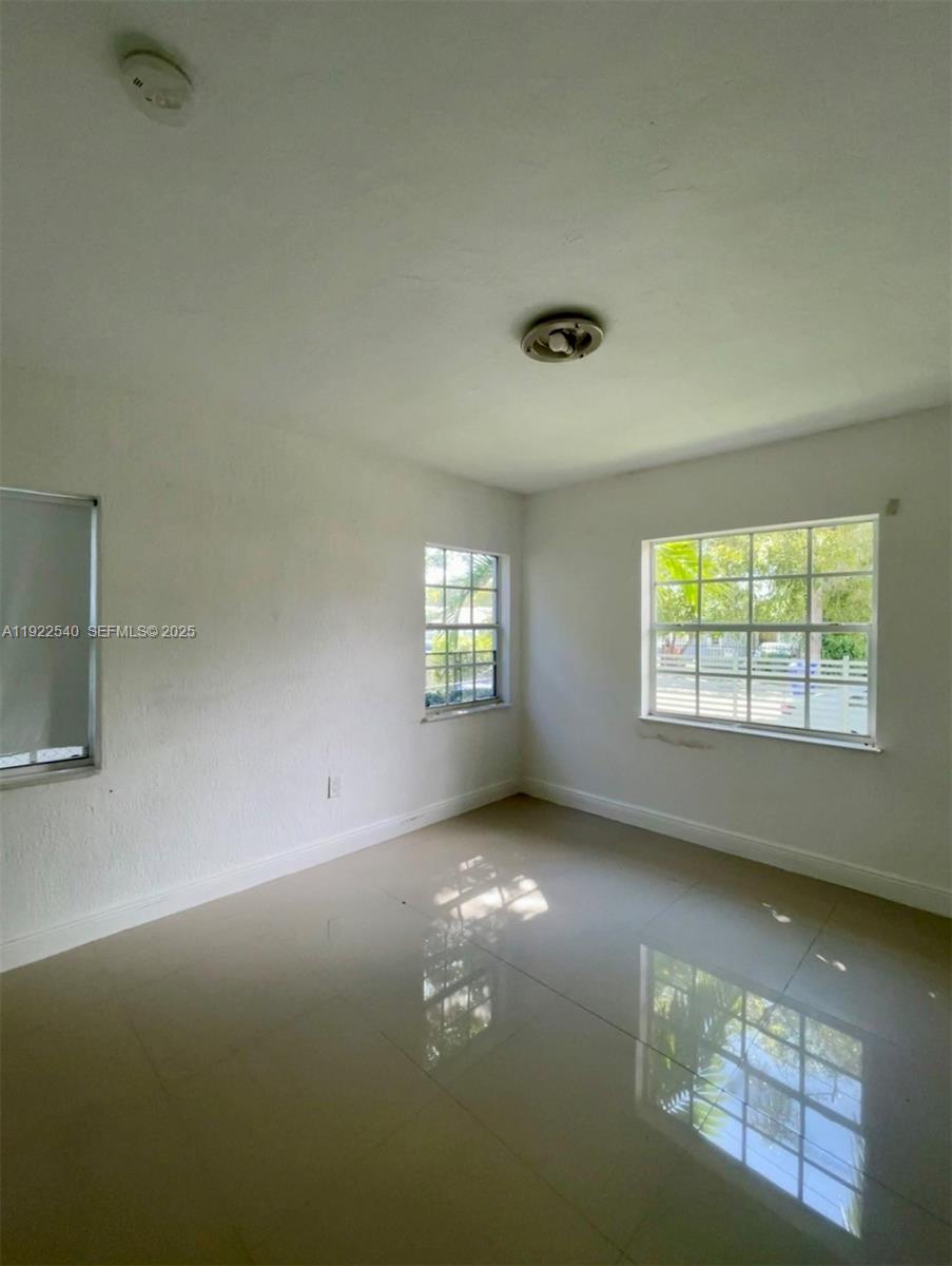 531 Northeast 68th Street, Unit 1 Miami, FL 33138 - Photo 6 of 11 a view of an empty room with a window