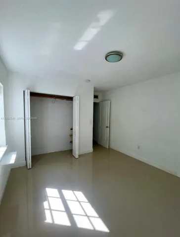 a bathroom with a toilet sink and shower