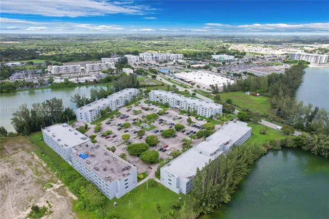 an aerial view of a house with a lake view