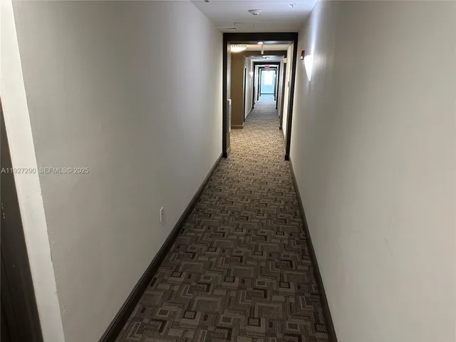 wooden floor with a hallway