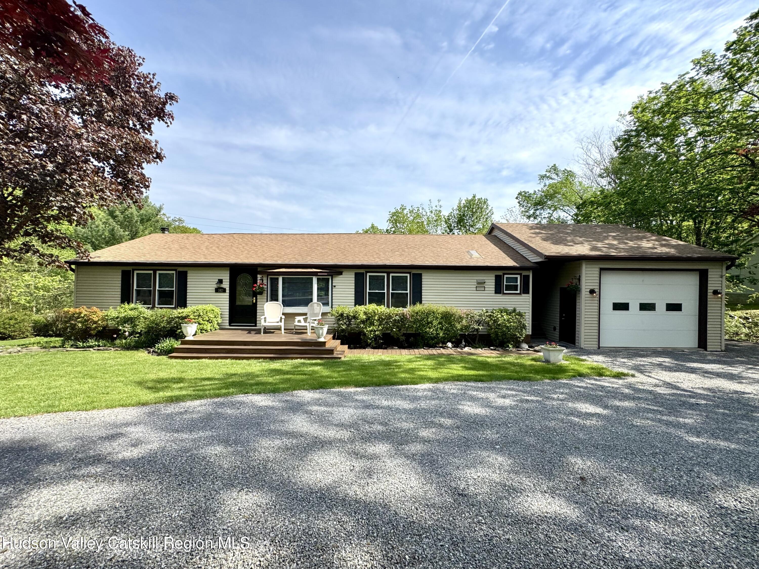 382 Cairo Junction Road Catskill, NY 12414 - Photo 1 of 26 a front view of a house with a yard and porch