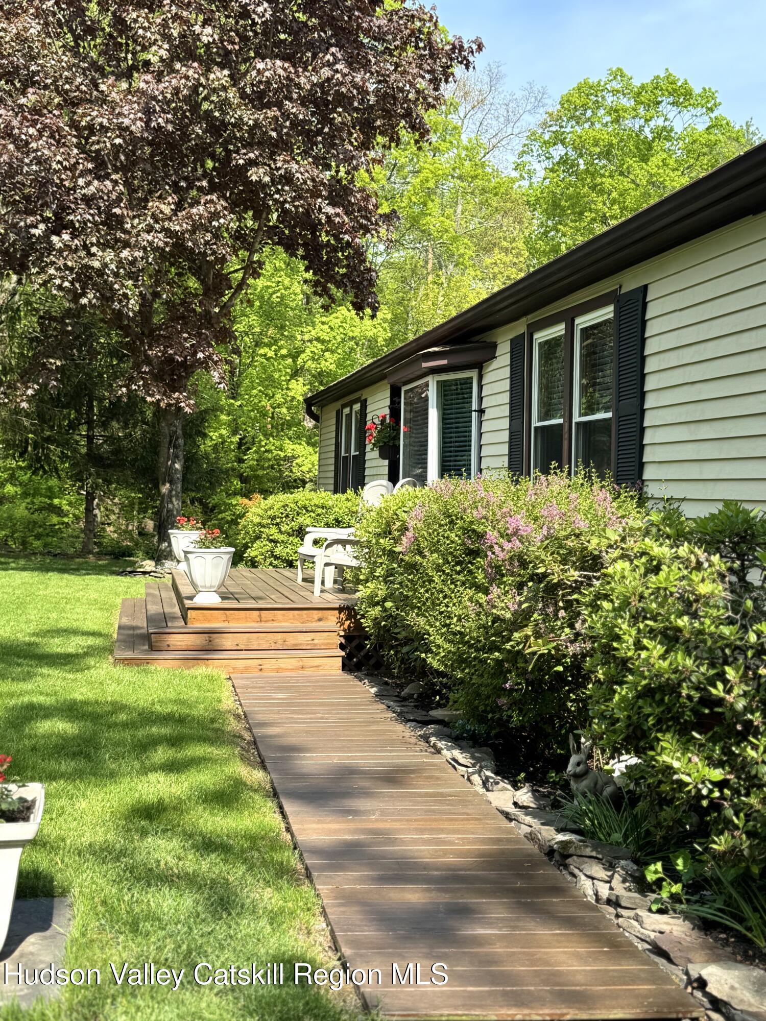 382 Cairo Junction Road Catskill, NY 12414 - Photo 2 of 26 a front view of a house with a yard and potted plants