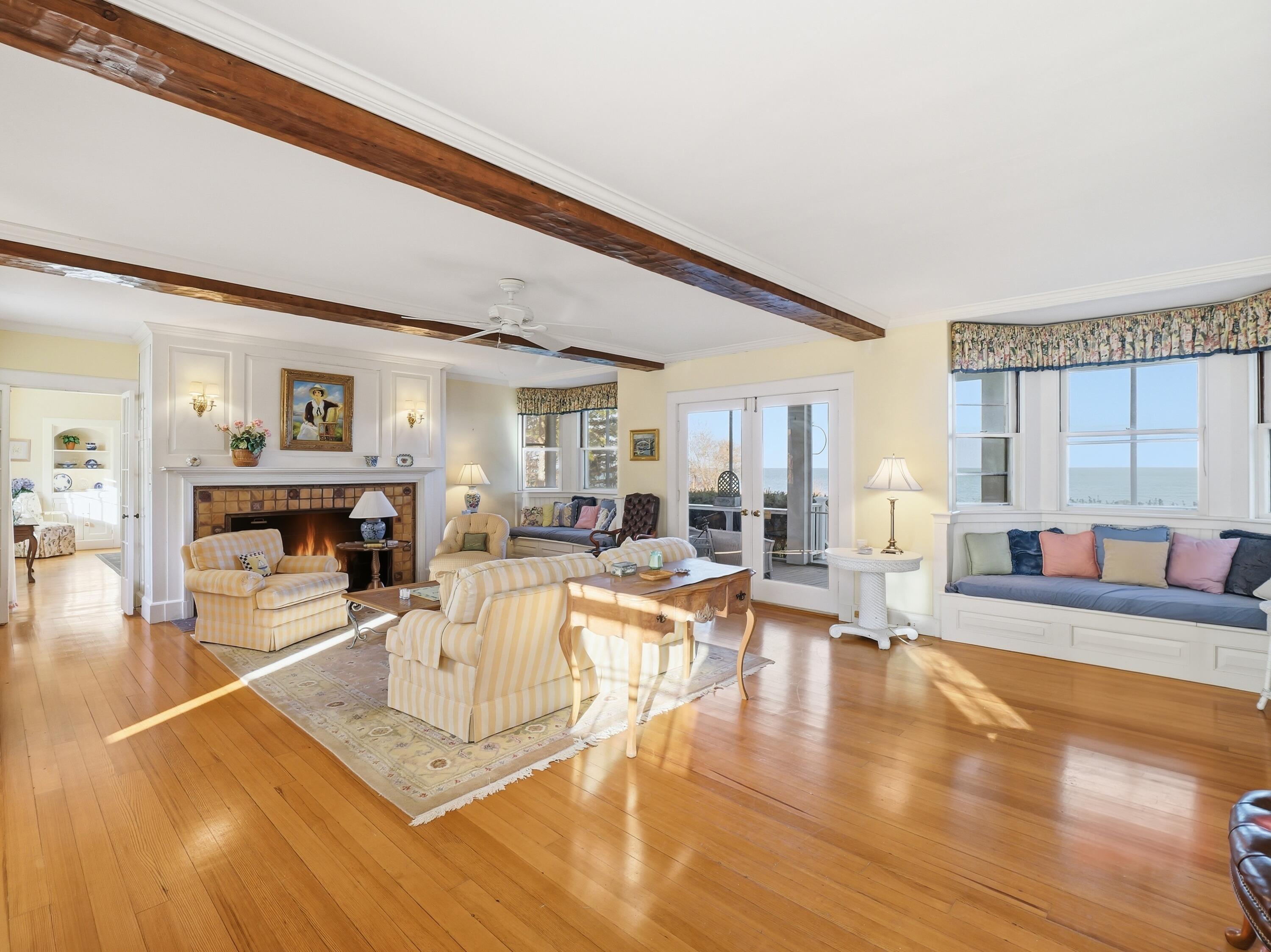 190 Vineyard Road Cotuit, MA 02635 - Photo 18 of 41 a living room with fireplace furniture and a wooden floor