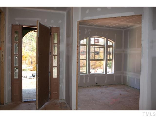 Light, bright entry foyer. Study to right will feature french doors with transom. 10' ceilings.
