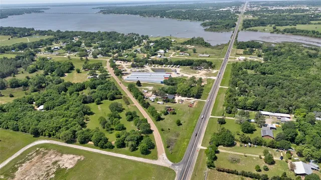 an aerial view of houses with yard