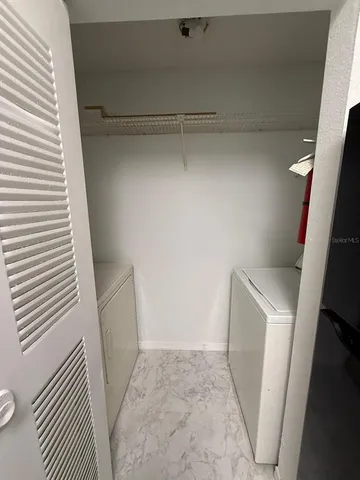 a view of storage and utility room with a sink