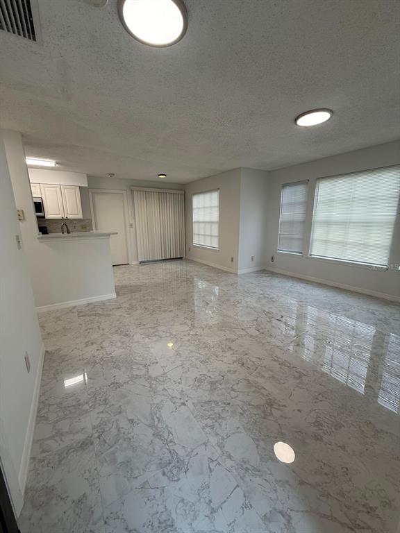 1089 South Hiawassee Road, Unit 314 Orlando, FL 32835 - Photo 14 of 24 an empty room with a empty space and windows