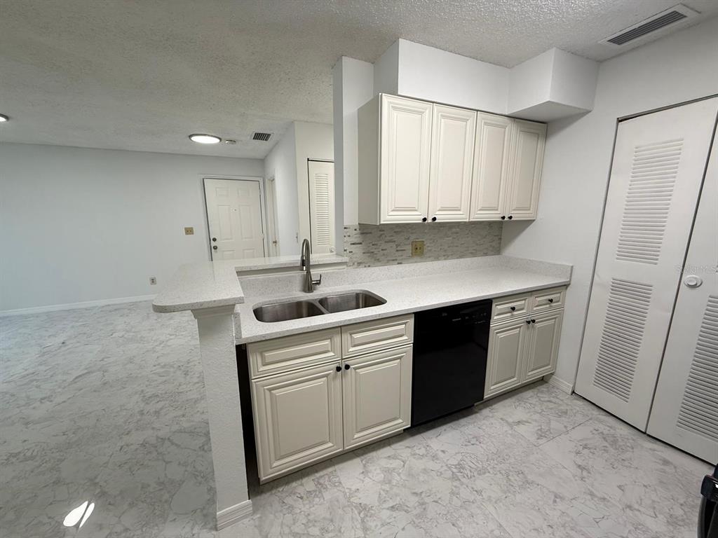1089 South Hiawassee Road, Unit 314 Orlando, FL 32835 - Photo 10 of 24 a kitchen with a sink cabinets and appliances