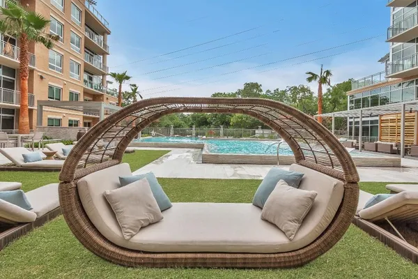 a view of swimming pool with seating space