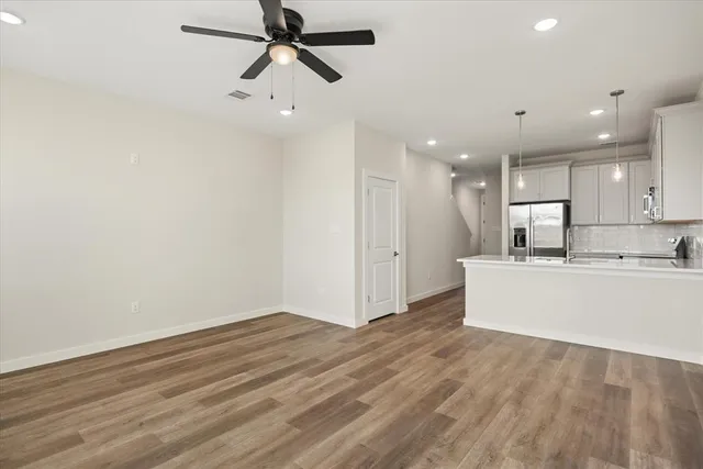 a view of kitchen with wooden floor and window