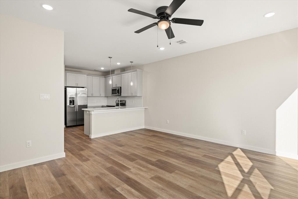 529 Galt Drive Stephenville, TX 76401 - Photo 14 of 27 a view of a kitchen with a sink and a refrigerator