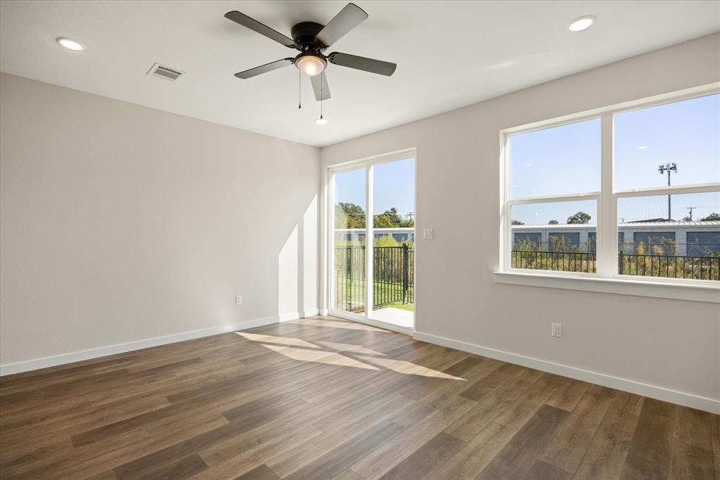 529 Galt Drive Stephenville, TX 76401 - Photo 15 of 27 a view of an empty room with a window and wooden floor