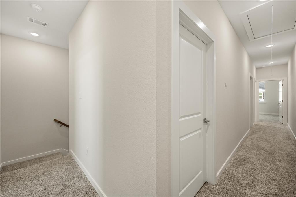 529 Galt Drive Stephenville, TX 76401 - Photo 19 of 27 a view of a hallway with closet and wooden floor