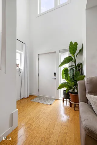 a view of a bedroom with a potted plant and a window